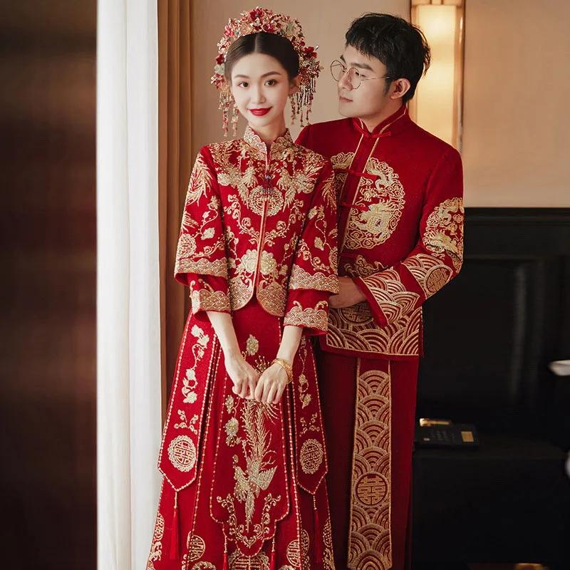 A Chinese-American couple, elegantly dressed in Miraclands Chinese wedding clothes, stands beside the bed in their new house. The bride’s Miraclands Chinese wedding dress, a red qipao wedding dress, embodies the traditional color of Chinese weddings, symbolizing good luck and fortune. The luxurious and elegant dragon and phoenix pattern, embroidered with gold thread, adds a touch of opulence to the attire, while the slim cut enhances the bride's beauty. For those searching for a Miraclands wedding dress online shop, this themed wedding dress offers a perfect blend of tradition and modernity. Whether you’re exploring American wedding dresses, Chinese wedding dresses, or pondering "what is my wedding dress style," the modern Chinese wedding dress from Miraclands stands out with its rich cultural significance and contemporary design. These dresses, sourced from Chinese clothing shops and Chinese clothing stores, cater to the modern bride seeking unique and meaningful attire. Whether for a traditional ceremony or a cruise wedding, the Miraclands Chinese wedding dress is an ideal choice. With a variety of options available, from modern wedding dresses to Chinese bridal dresses and Asian bridal gowns, Miraclands offers something special for every bride’s journey.