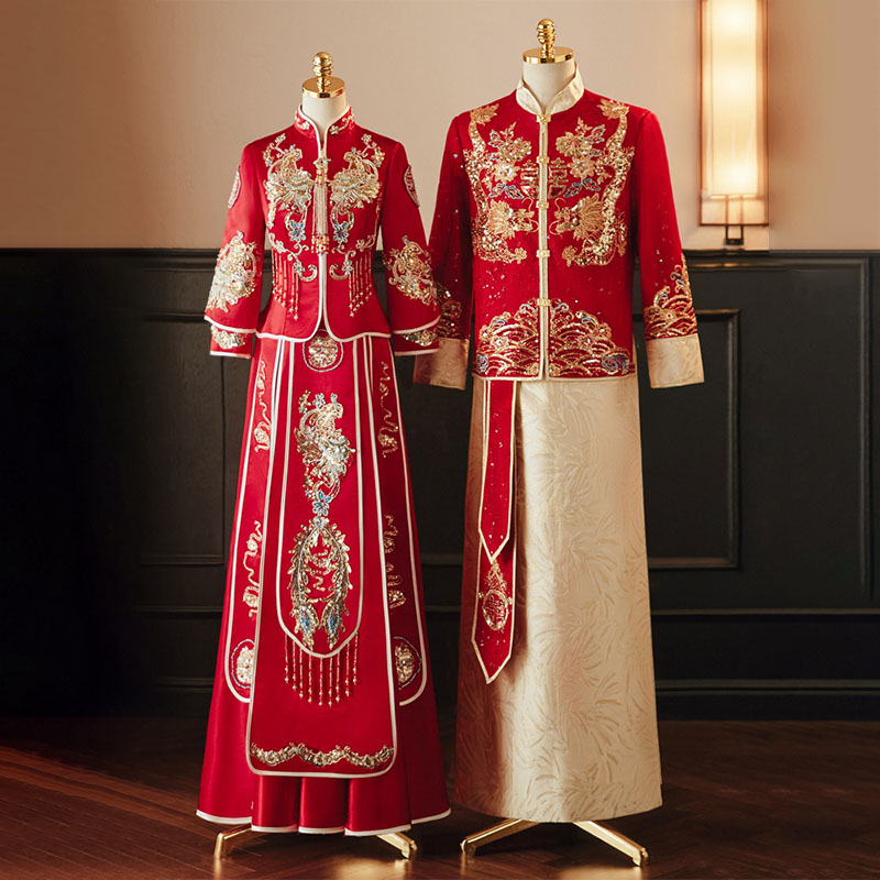 The Miraclands wedding collection features a stunning Chinese traditional bride and groom red wedding dress set. This exquisite ensemble, crafted in festive red, showcases intricate dragon and phoenix embroidery, embodying the opulence and cultural heritage of a Chinese wedding dress hanfu. The bride's long Chinese wedding dress for women is beautifully paired with the groom's Chinese wedding long red dress with hanfu for man, creating a harmonious and elegant look for the ceremony. This Chinese qi pao wedding traditional dress set is the epitome of a Chinese wedding party dress, where every detail, from the rich color to the ornate embroidery, reflects the celebratory nature of a Chinese wedding dress red. The luxurious Chinese wedding dress red hanfu enhances the festive atmosphere, making it a perfect choice for a Chinese style wedding dress. For the bride, the Chinese wedding dress women offers a timeless elegance, merging traditional design with modern touches. This women Chinese wedding dress stands out as a wedding dress Chinese version, often seen in Chinese drama wedding dress scenes, adding a touch of cinematic beauty to the celebration. Guests can complement the bridal couple's attire by wearing a Chinese wedding guest dress or a Chinese ancient wedding dress, aligning with the cultural theme. The overall ensemble, including the Asian wedding guest outfit and the luxurious Chinese bridal dresses, captures the essence of wedding dress in China, making it a standout choice for any dress for wedding ceremony.